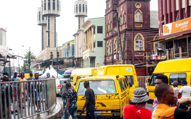 Lagos, Nigeria: Local people and city taffic in Lagos Island market district near main mosque